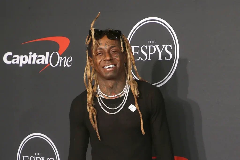 Lil Wayne Inks Deal With Travis Hunter Ahead Of NFL Draft