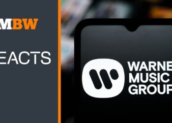 On… Warner’s cutbacks, and the bigger story.