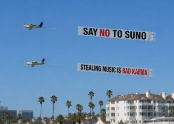 Remember ‘Say No To Suno’? Someone just hired a plane to fly it over an AI investor summit… featuring Mikey Shulman.